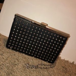 Silver studded leather clutch with crossbody chain